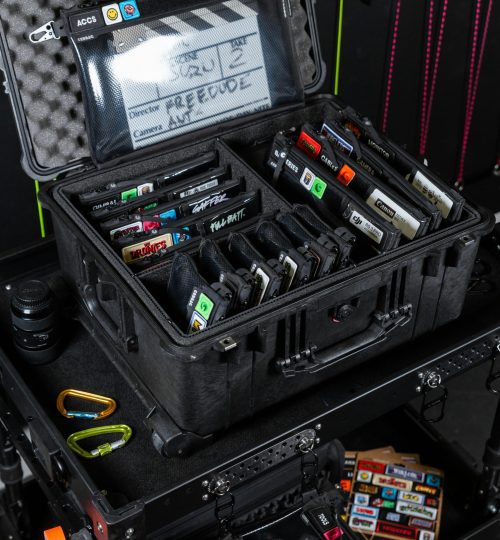 A detailed view of organized camera equipment in a professional storage case, perfect for videography.